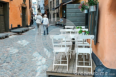 Free cafe table on European town street Editorial Stock Photo