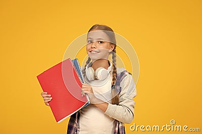 Free courses. Welcome back to school. Motivate kids for academic year ahead. School girl hold books. School lesson Stock Photo