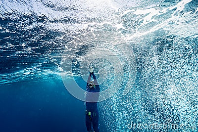 Free diver ascending from the depth Stock Photo