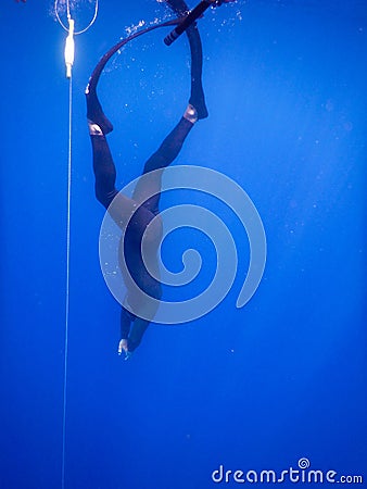 Start of an apnea dive in the Ligurian sea in front of Noli, Liguria - Italy Stock Photo