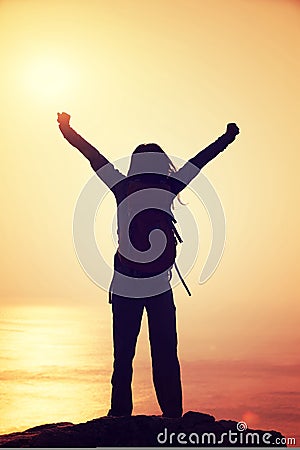 Free female hiker with backpack open arms Stock Photo