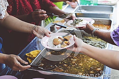 Free food for poor and homeless: Concept serving free food to the poor Stock Photo