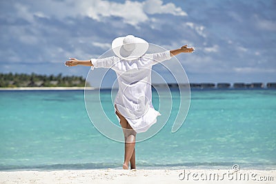 Free happy woman on beach enjoying nature. Natural beauty girl o Stock Photo