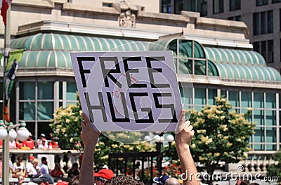 Free Hugs Sign in Public Editorial Stock Photo