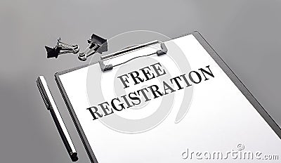 FREE REGISTRATION text on white paper sheet on black background Stock Photo