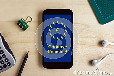 Free roaming concept on smart phone screen on wooden desk Stock Photo