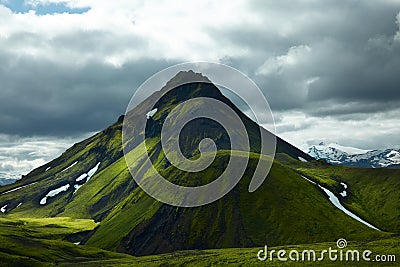 Free standing volcanic mountain covered with green moss Stock Photo