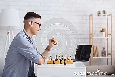 Free time, leisure and hobbies. Man teaching play chess remotely Stock Photo