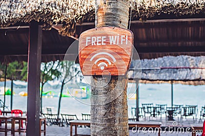 Free WiFi arrow on the beach Stock Photo