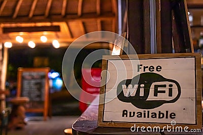 Free wifi sign wooden board in restaurant of Bali island, Indonesia. Editorial Stock Photo