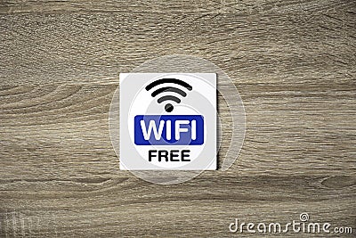 Free WiFi sign on wooden wall Stock Photo