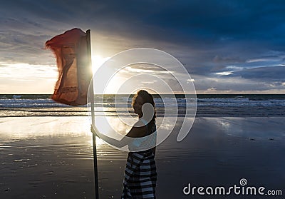 Free woman enjoying freedom feeling happy at beach at sunset. Beautiful serene relaxing woman in pure happiness and Stock Photo