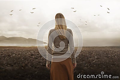 Free woman walks towards infinity in the midst of nature Stock Photo