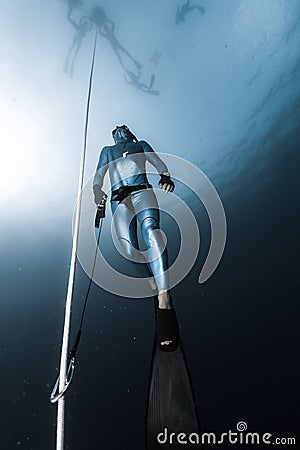 Freediver ascends from a depth Stock Photo