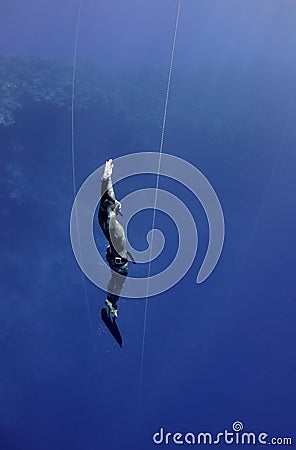 Freediver returns from the deep dive Stock Photo