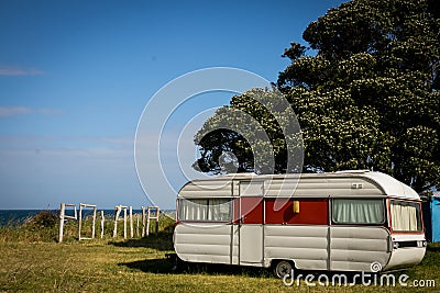 Freedom camping in caravan at an East Coast beach, Gisborne, North Island, New Zealand Editorial Stock Photo