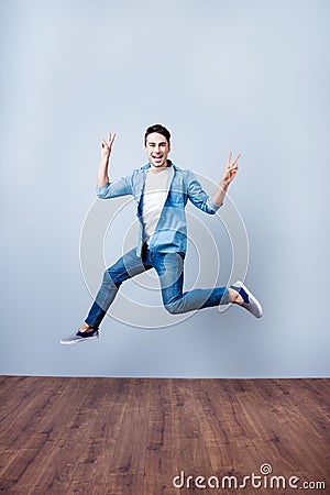 Freedom, carefree, fun, summer mood. Excited brunete guy is jump Stock Photo