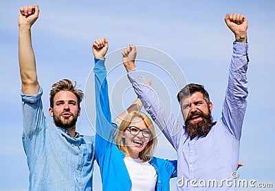 Freedom concept. Company happy colleagues office workers enjoy freedom friday evening, sky background. Employees enjoy Stock Photo