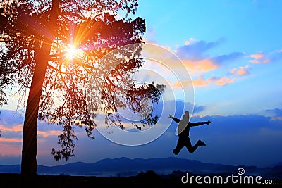 Freedom concept,silhouette women jumping happily in holiday,young teenagers recreation wiht adventure and camping Stock Photo