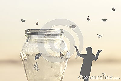 Freedom concept of a woman rescuing butterflies closed in a vase Stock Photo