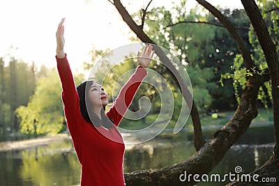 Freedom happy woman feeling alive and free in nature breathing clean and fresh air Stock Photo