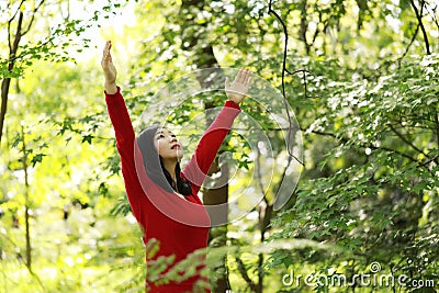 Freedom happy woman feeling alive and free in nature breathing clean and fresh air Stock Photo