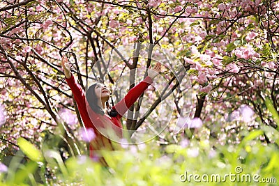 Freedom happy woman feeling alive and free in nature breathing clean and fresh air Stock Photo