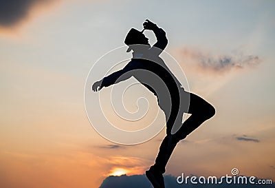 freedom. personal achievement goal. man dancer silhouette jump and dance on sky background. Stock Photo