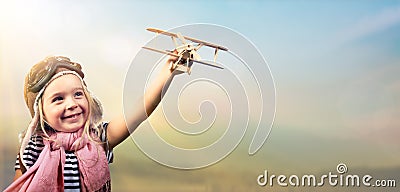 Freedom To Dream - Joyful Child Playing With Airplane Stock Photo