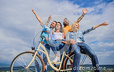 Freedom urban commuting. Company stylish young people spend leisure outdoors sky background. Bicycle as part of life Stock Photo