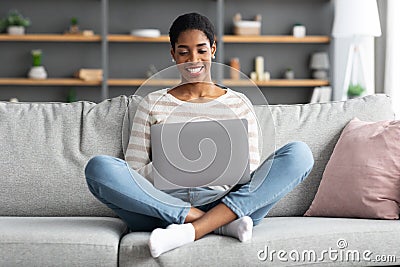 Freelance Career. Young Smiling Black Lady Working With Laptop At Home Stock Photo