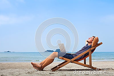 Freelancer, happy successful businessman on the beach Stock Photo