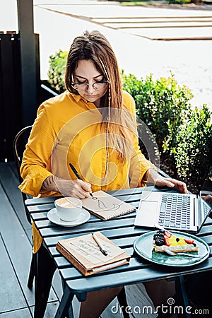 Freelancer problem challenges, Finding work, Finding clients. Freelancer woman working with laptop and writing question Stock Photo