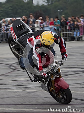 Freestyle motorcycle shows with front wheel riding Editorial Stock Photo