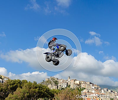 The freestyle Quad bike pilot makes a jump with a high jump Editorial Stock Photo