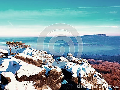 Freeze autumn trek, rocks covered with first fresh snow. Stock Photo