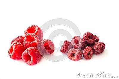 Freeze dried and fresh raspberries on a white background. Stock Photo