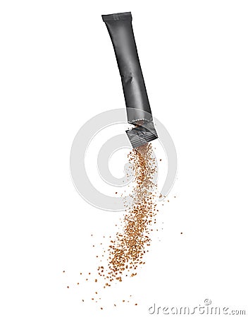 Freeze dried instant coffee pours from the packaging, isolated on a white background Stock Photo