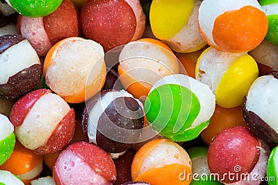 Freeze dried Skittles hard candy macro with splits through their centers. Stock Photo