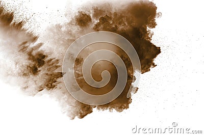 Freeze motion of brown dust explosion. Stopping the movement of brown powder. Stock Photo