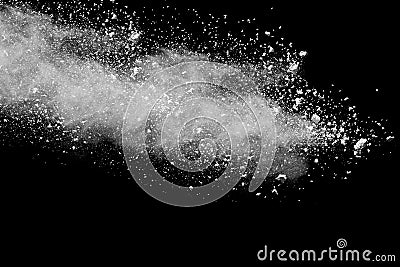 Freeze motion explosion of white dust on a black background. Stock Photo