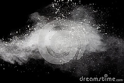 Freeze motion of white dust particles splash on black background.White powder explosion clouds Stock Photo