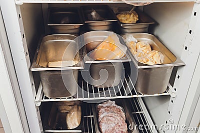 Freezer refrigerator with various frozen foods billet storage restaurant. Stock Photo