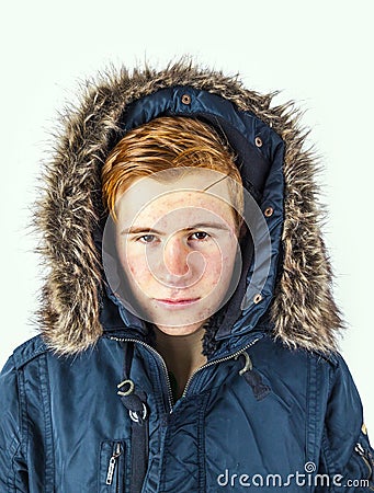 Freezing boy in winter clothes Stock Photo