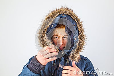 Freezing boy in winter clothes Stock Photo