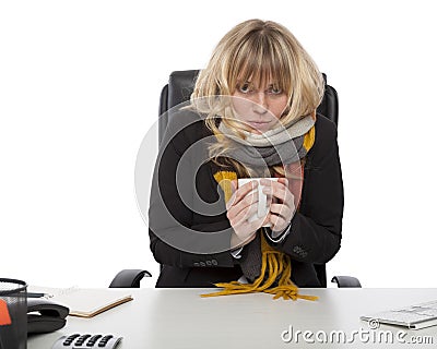 Freezing businesswoman warming up with coffee Stock Photo