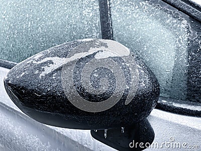 Freezing rain. Close-up details of a frozen parked car in the morning of a winter day. Stock Photo