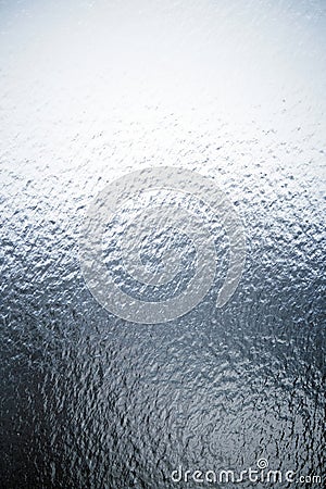 Freezing rain on a window, ice on the windowpane. Frost ice patterns on a window glass. Rime on a windowpane, Bitter Stock Photo