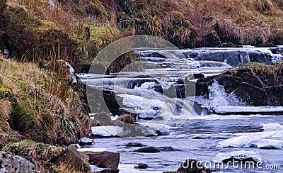 A Freezing Scottish Burn or River in Winter Stock Photo