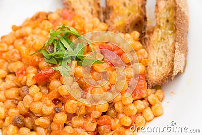 Fregola with tomato sauce Stock Photo